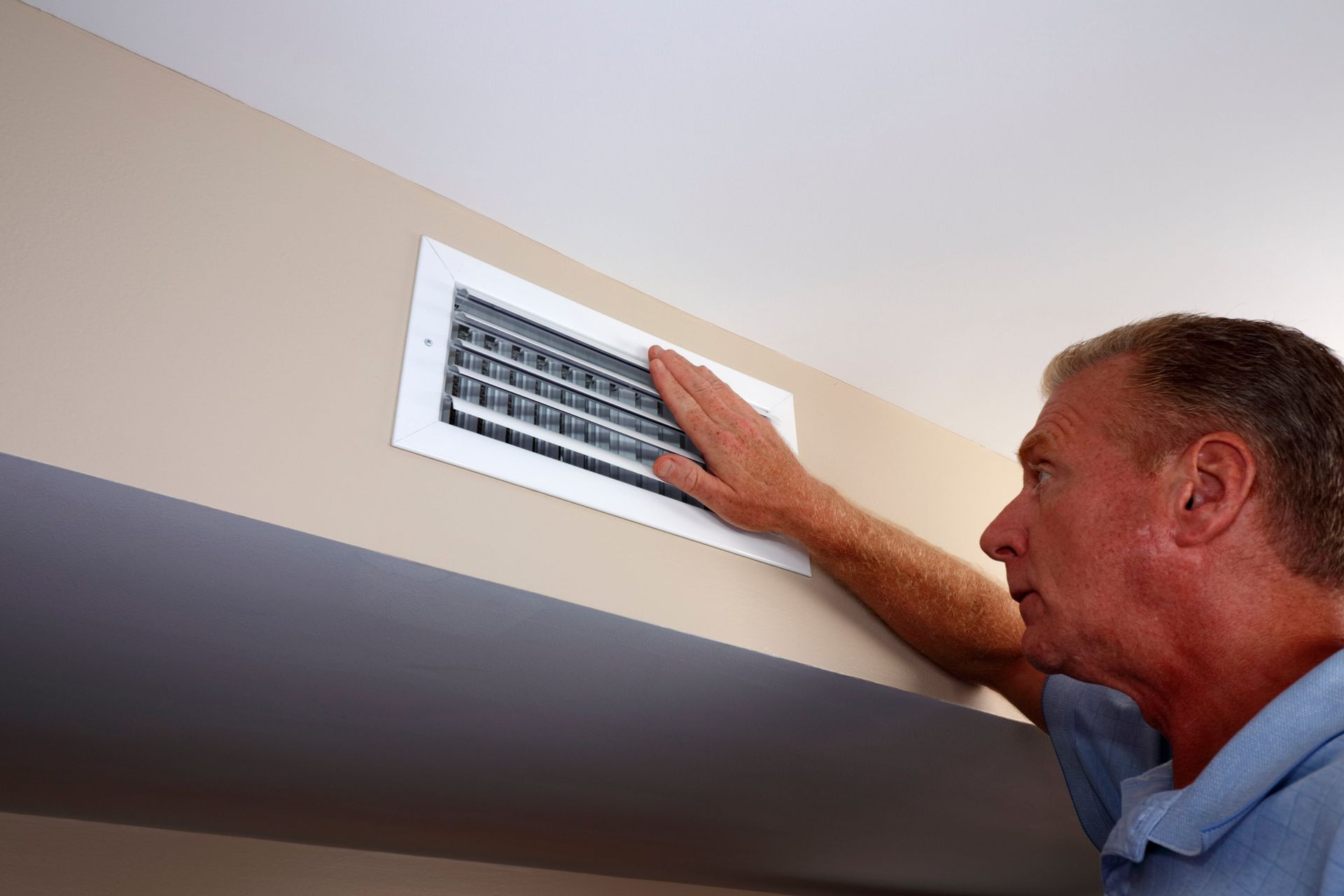 Checking airflow in Arlington, TX house