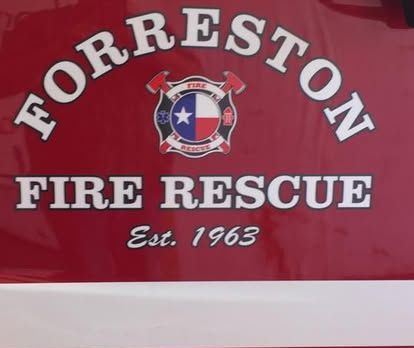 A red sign that says Forreston fire rescue