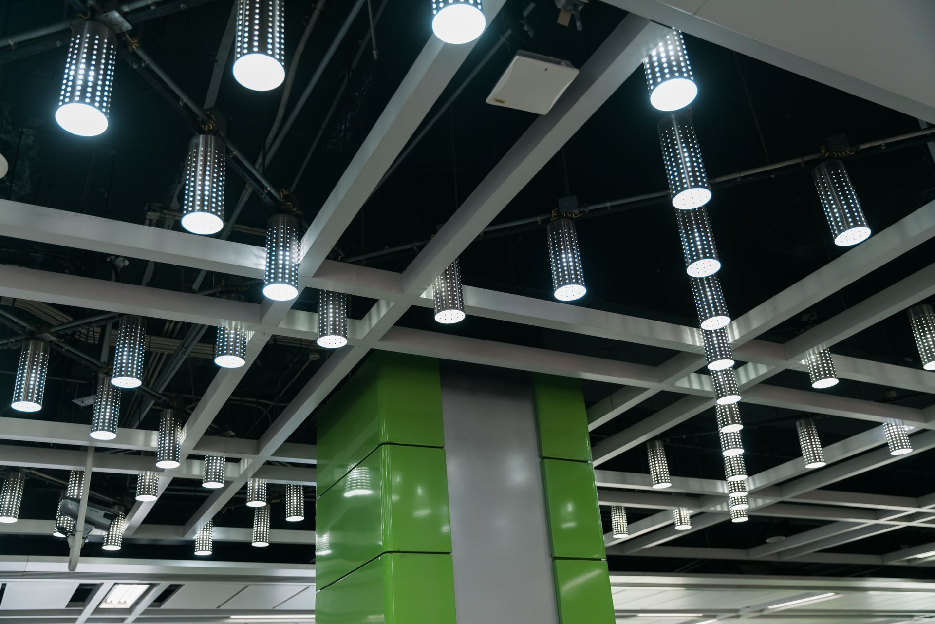 A ceiling with a lot of lights hanging from it