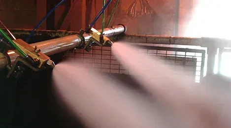 A close up of a machine spraying water in a room.