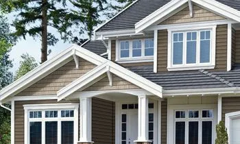 A large house with a lot of windows and a porch.