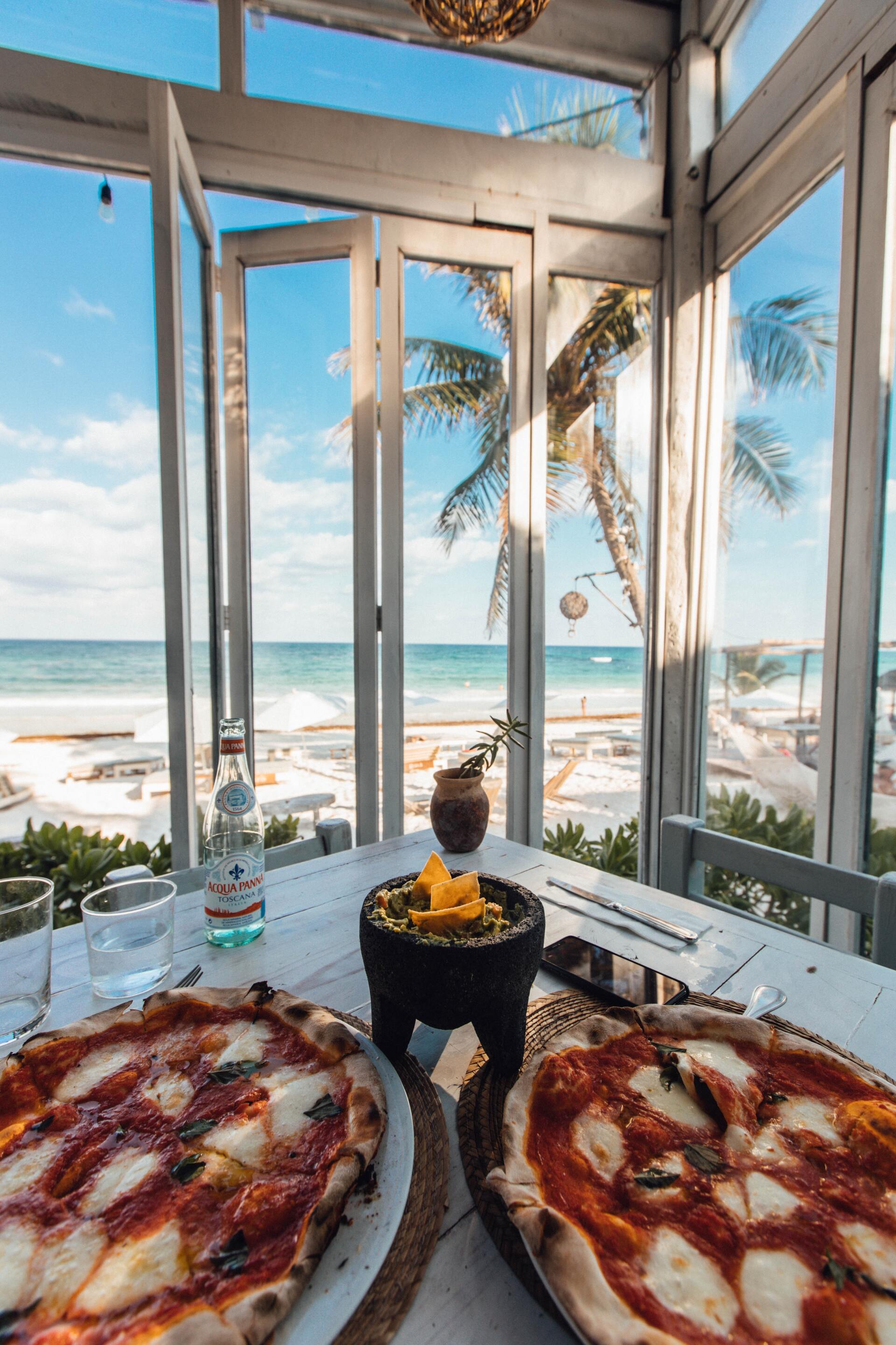 Land and Sea Travel Table with Pizza and beach view