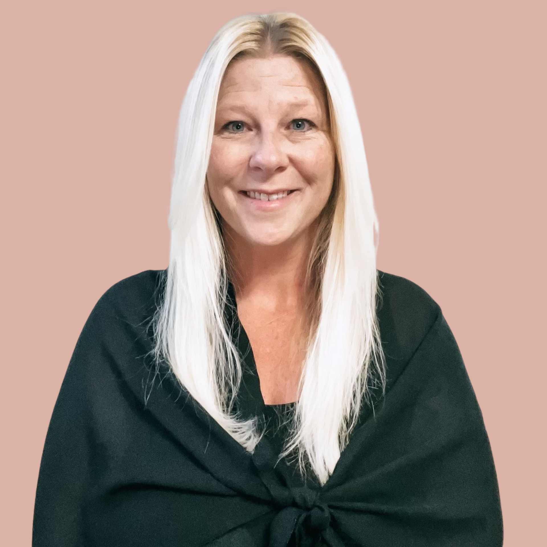 Kathryn Stansbury sitting at a desk at Land and Sea Travel