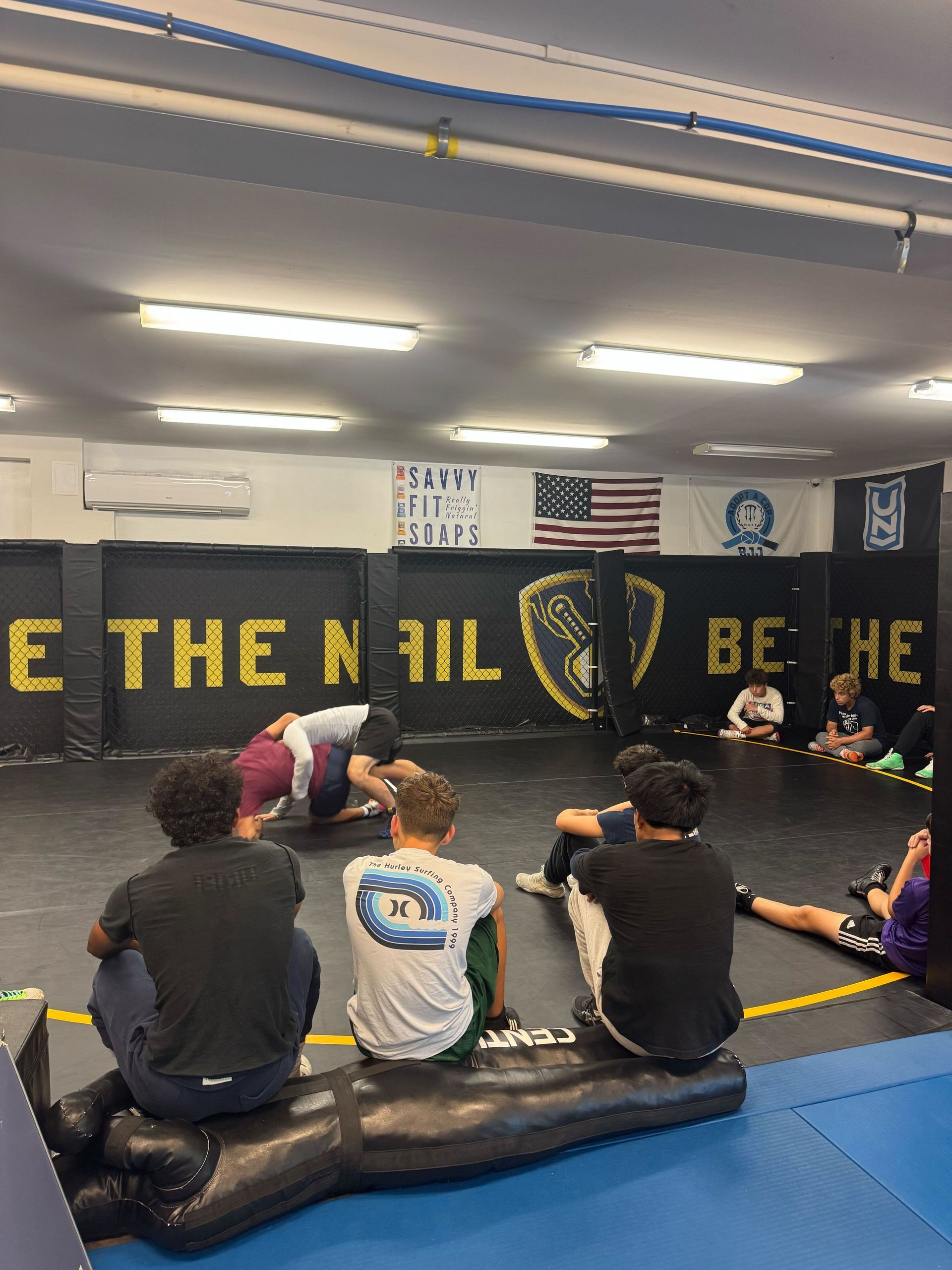 Adults drilling Brazilian Jiu-Jitsu at Hammer Sports and Performance in Hazlet, NJ, building confidence and wellness.