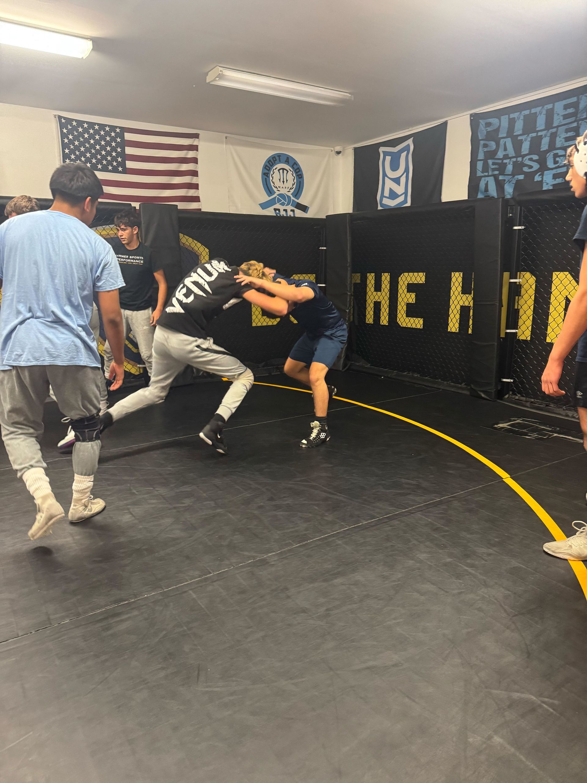 Adults practicing Jiu-Jitsu sparring at Hammer Sports and Performance in Hazlet, NJ to build focus and resilience.