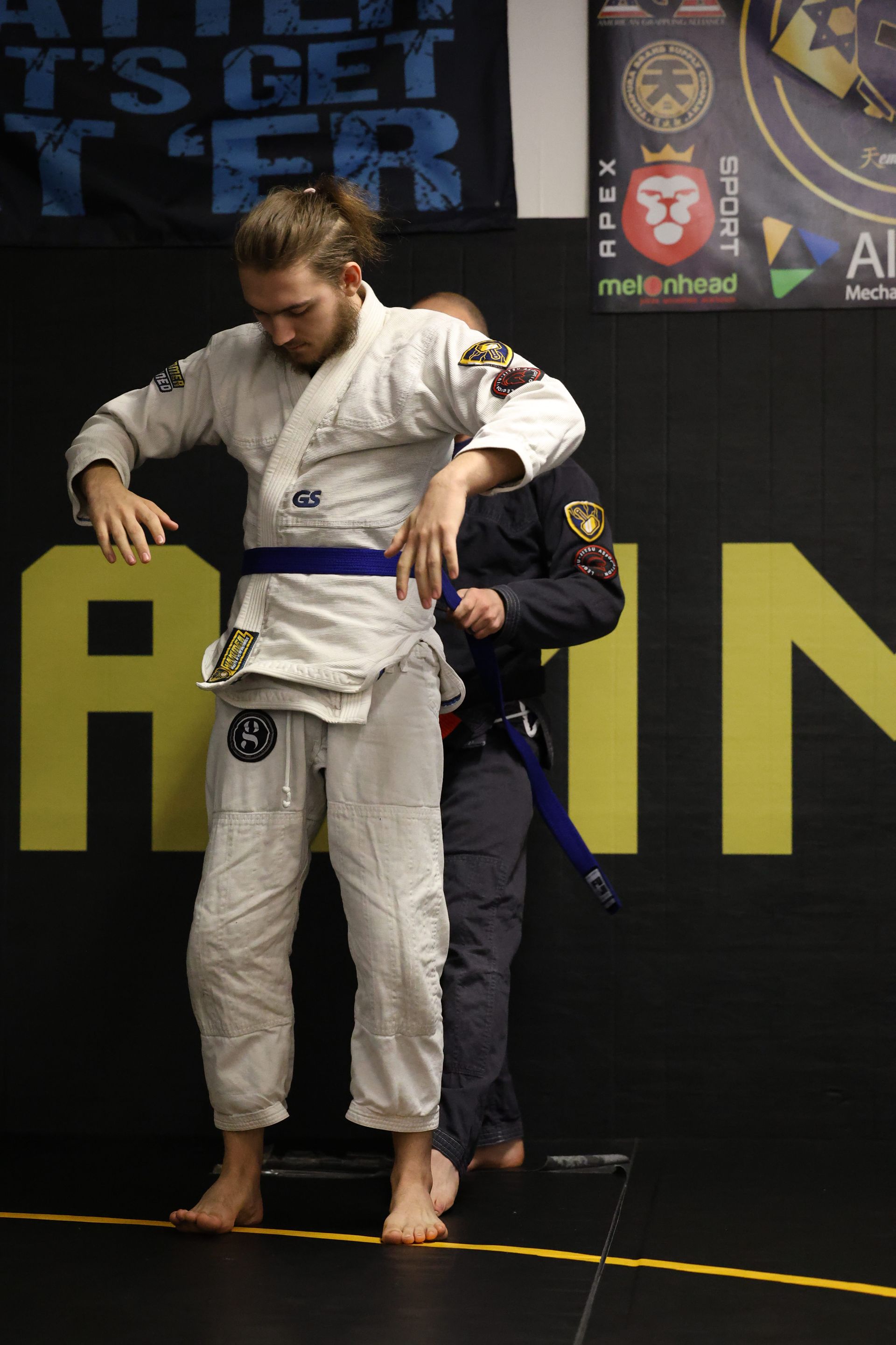 Adults drilling Brazilian Jiu-Jitsu techniques at Hammer Sports and Performance in Hazlet, NJ.