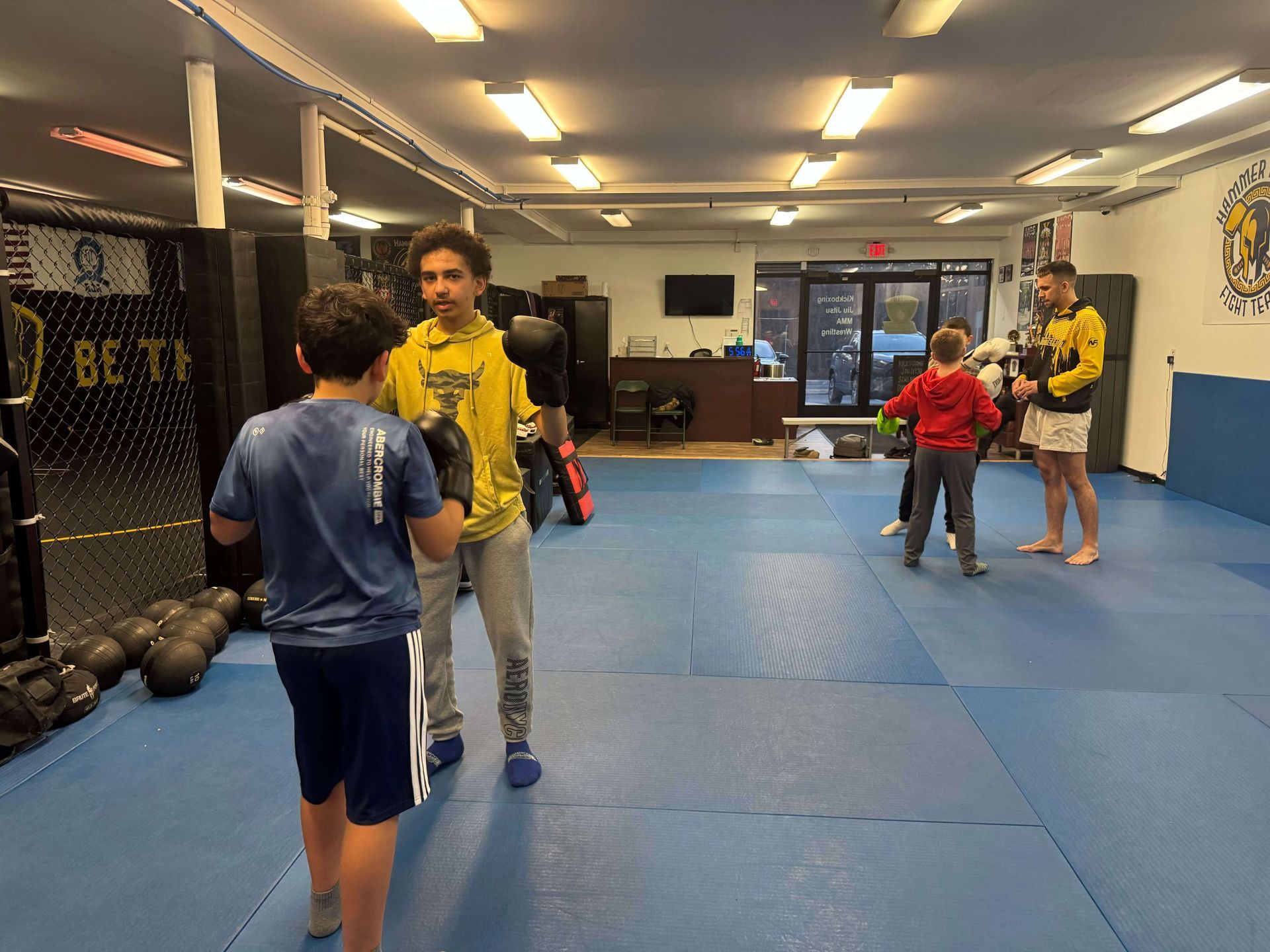Kids practicing safe grappling drills at Hammer Sports and Performance in Hazlet, NJ, building confidence and coordination