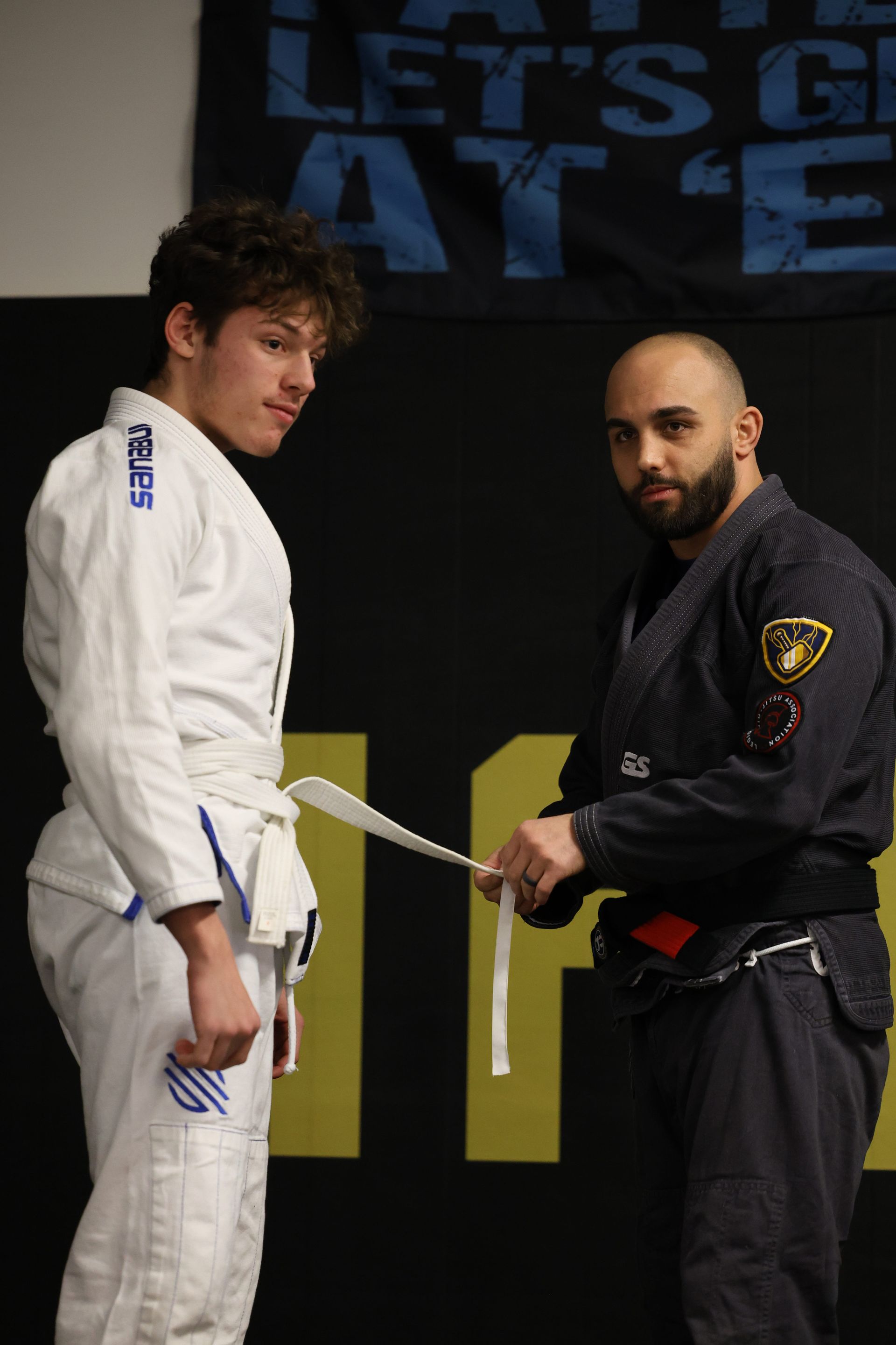 Adult Jiu-Jitsu partners drilling a controlled grappling sequence at Hammer Sports and Performance.