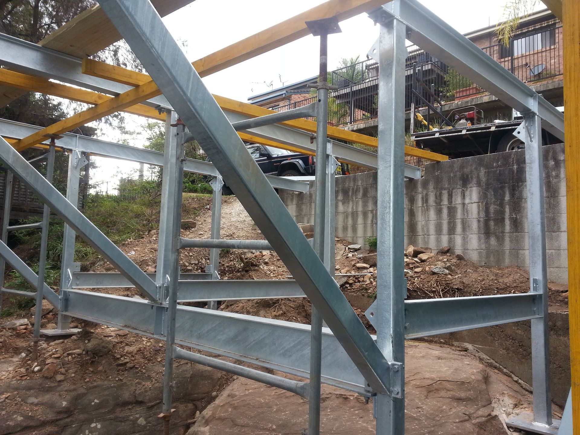 A Galvanized Steel Framework for A Building Project Sits on A Rocky Site — Real Engineering in West Gosford, NSW