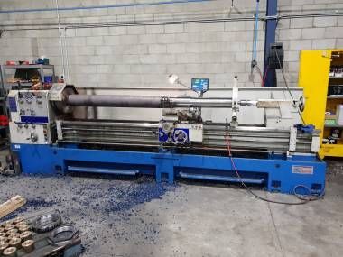 A Blue Industrial Metal Lathe Machine Sits in A Workshop — Real Engineering in West Gosford, NSW