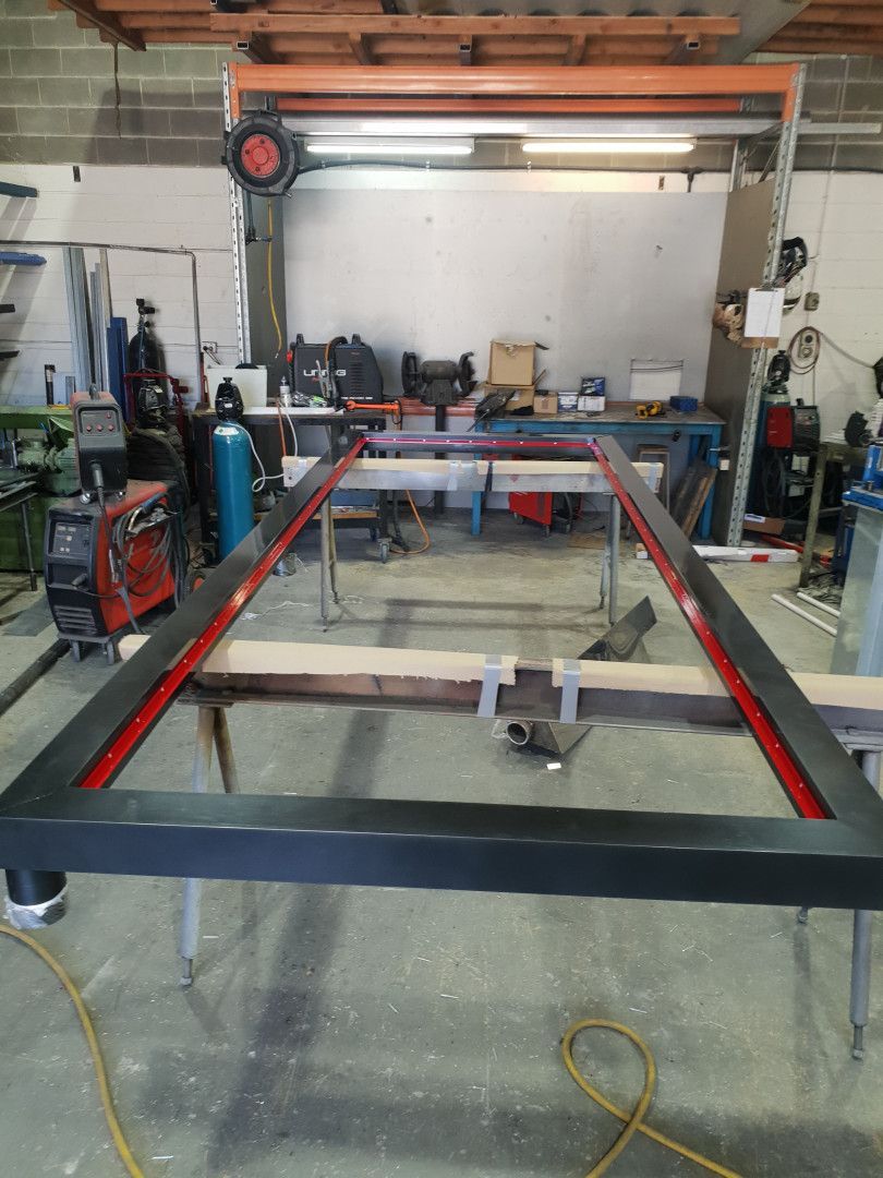 A Rectangular Metal Frame Painted Black with A Red Interior Edge — Real Engineering in West Gosford, NSW
