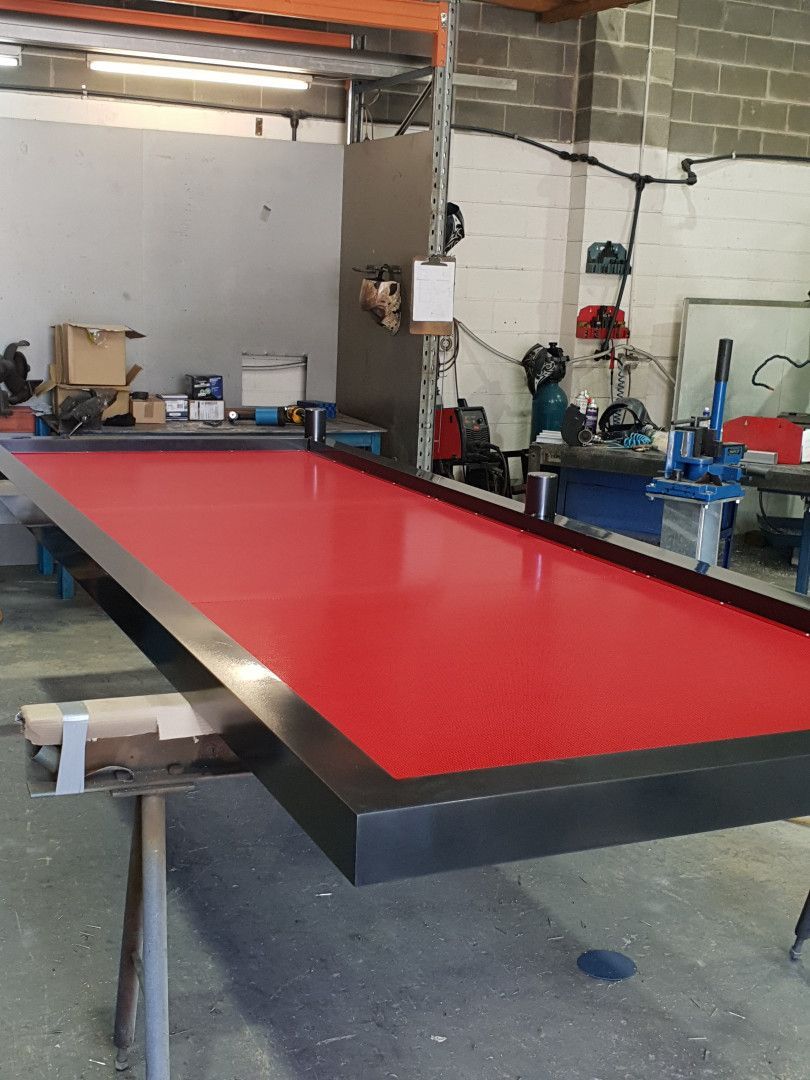 A Red Rectangular Table with A Black Metal Frame — Real Engineering in West Gosford, NSW