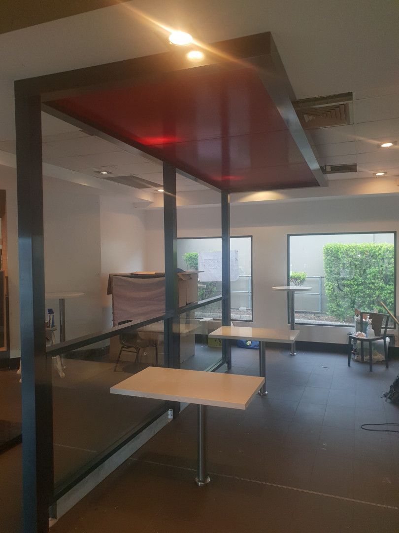 A Modern, Open-Concept Indoor Space with A Black-Framed Glass Partition — Real Engineering in West Gosford, NSW