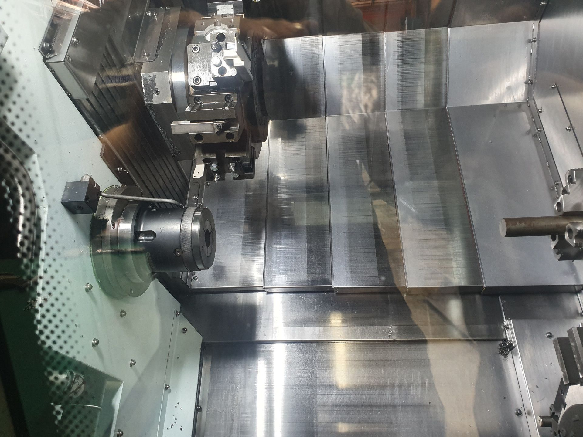 The Interior of A Cnc Lathe Machine Showing a Metal Chuck, a Tool Turret — Real Engineering in West Gosford, NSW
