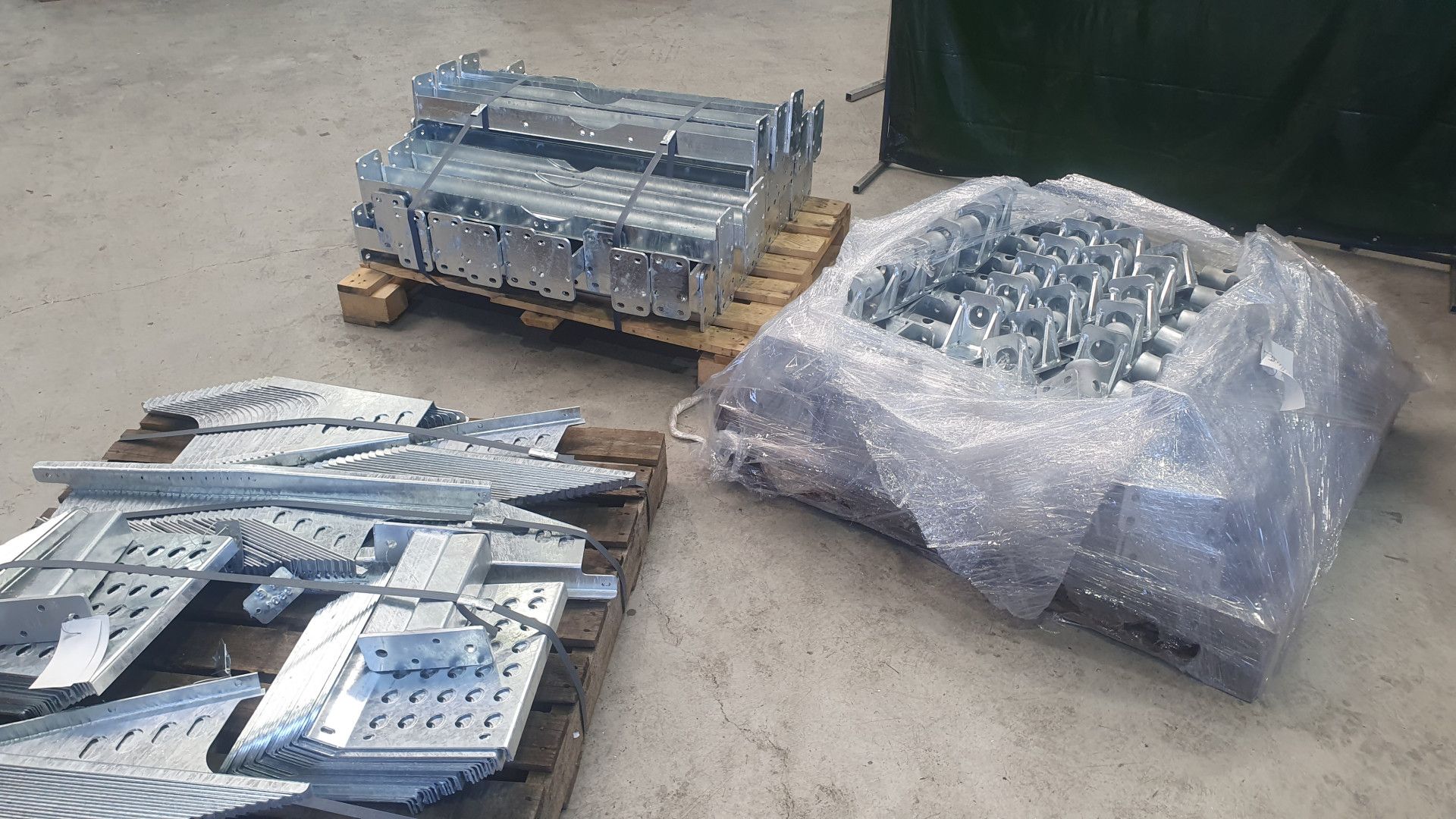 Three Wooden Pallets Holding Assorted Industrial Galvanized Metal Components — Real Engineering in West Gosford, NSW