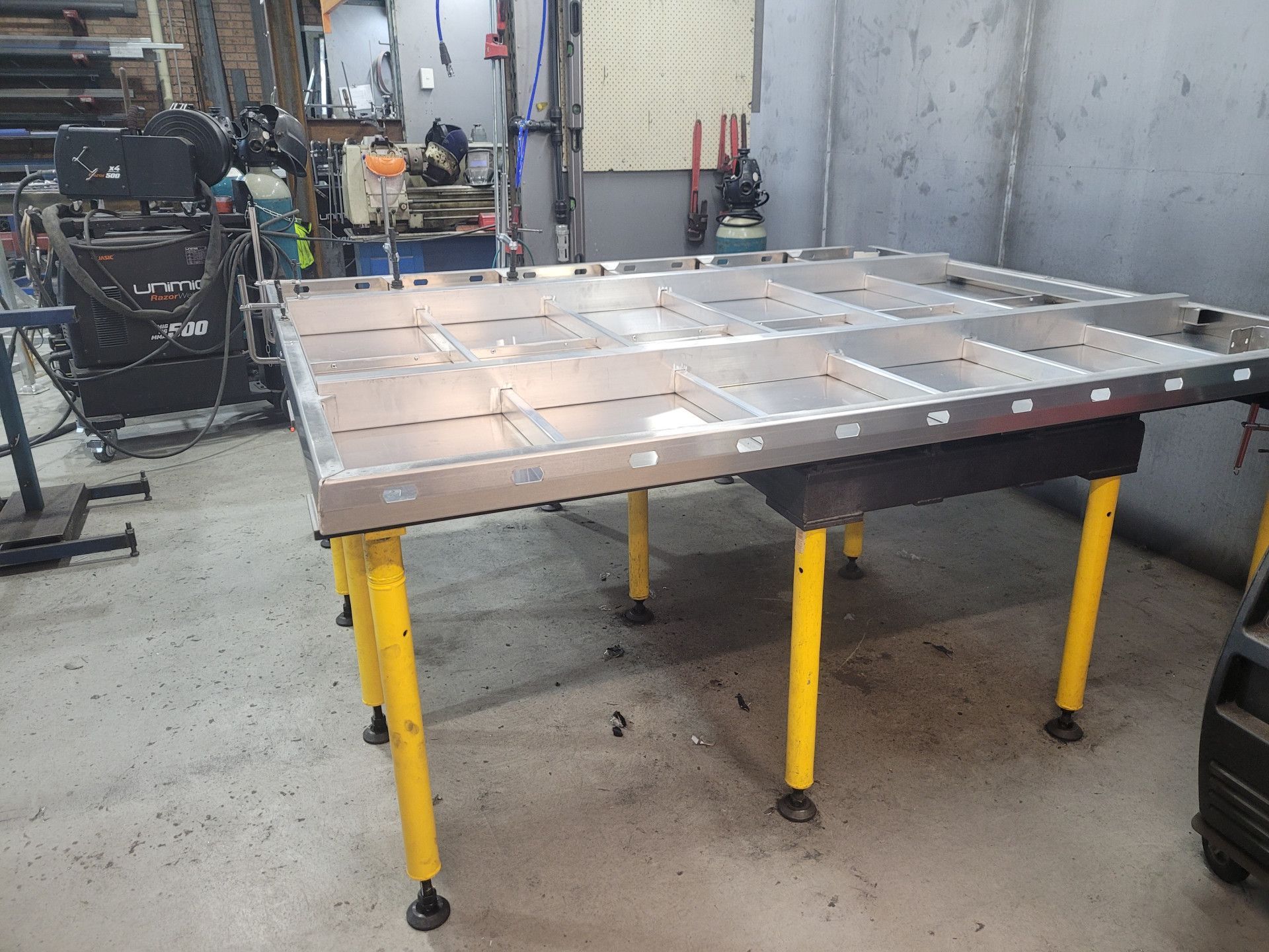 A Large, Rectangular Metal Welding Table with A Grid Pattern — Real Engineering in West Gosford, NSW