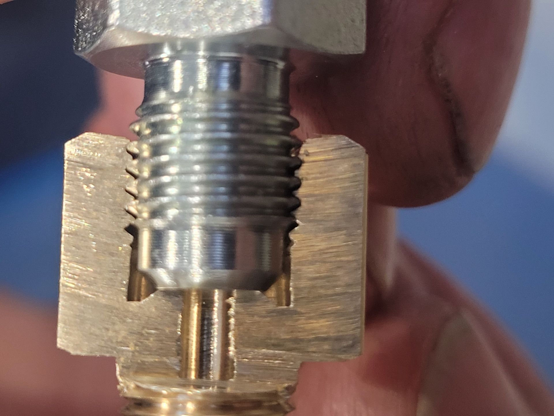 A Cross-Section View of A Metal Fitting with A Threaded Bolt Screwed — Real Engineering in West Gosford, NSW