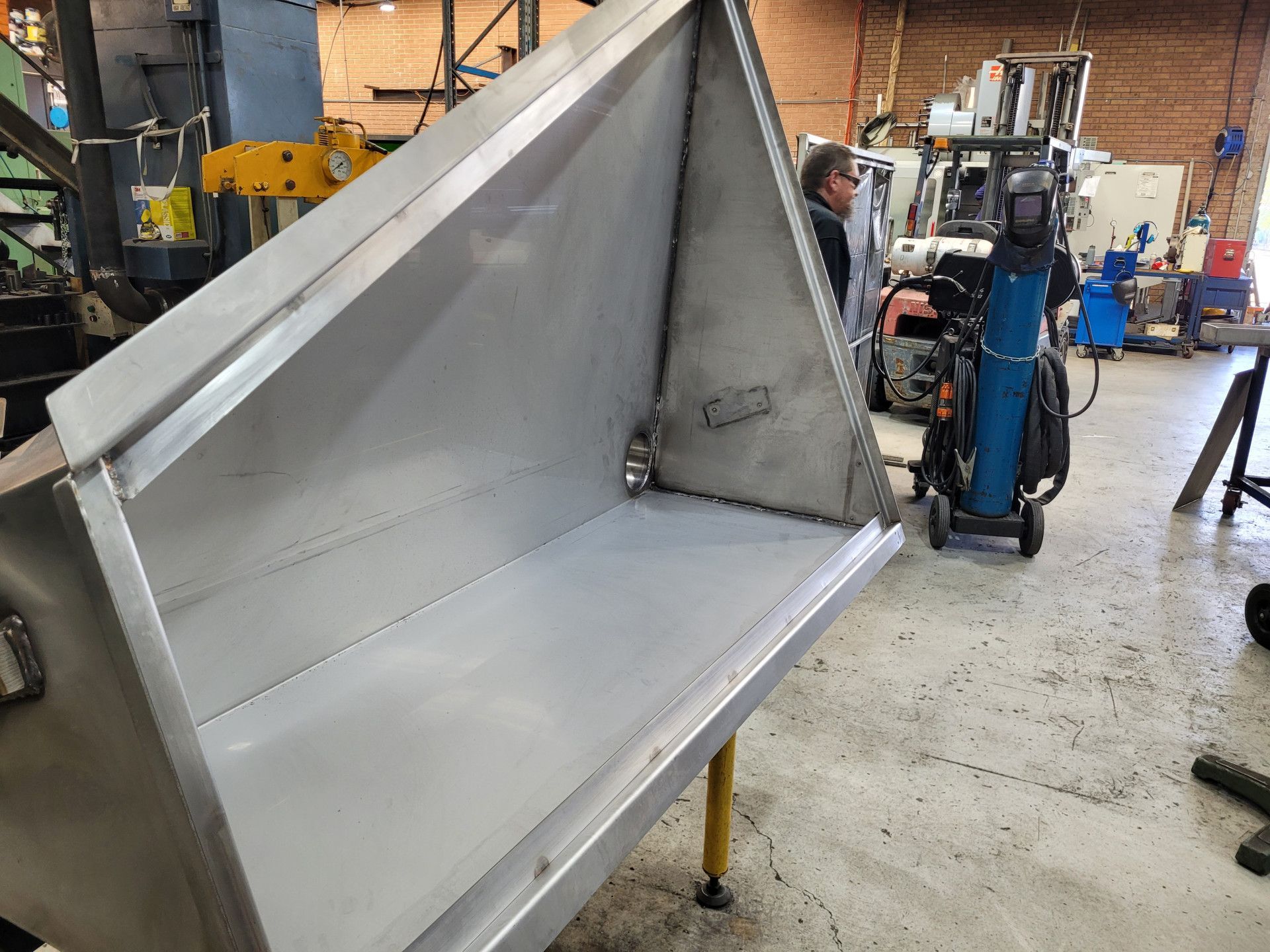 A Large, Custom-Fabricated Stainless Steel Hopper in A Metal Fabrication Workshop — Real Engineering in West Gosford, NSW