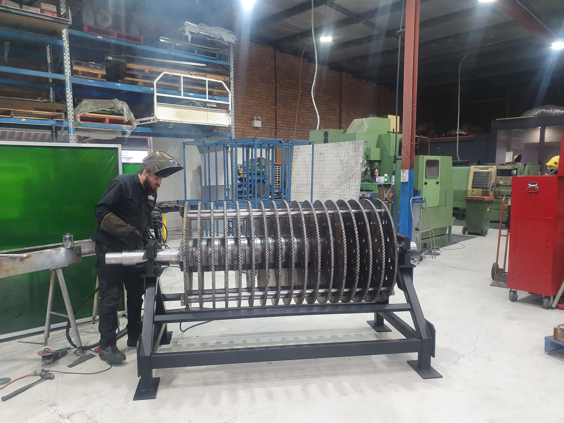A Machine Is Cutting A Piece Of Wood With A Laser — Real Engineering in Seven Hills, NSW