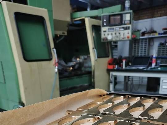 A Workshop with A Large Green Cnc Milling Machine — Real Engineering in West Gosford, NSW