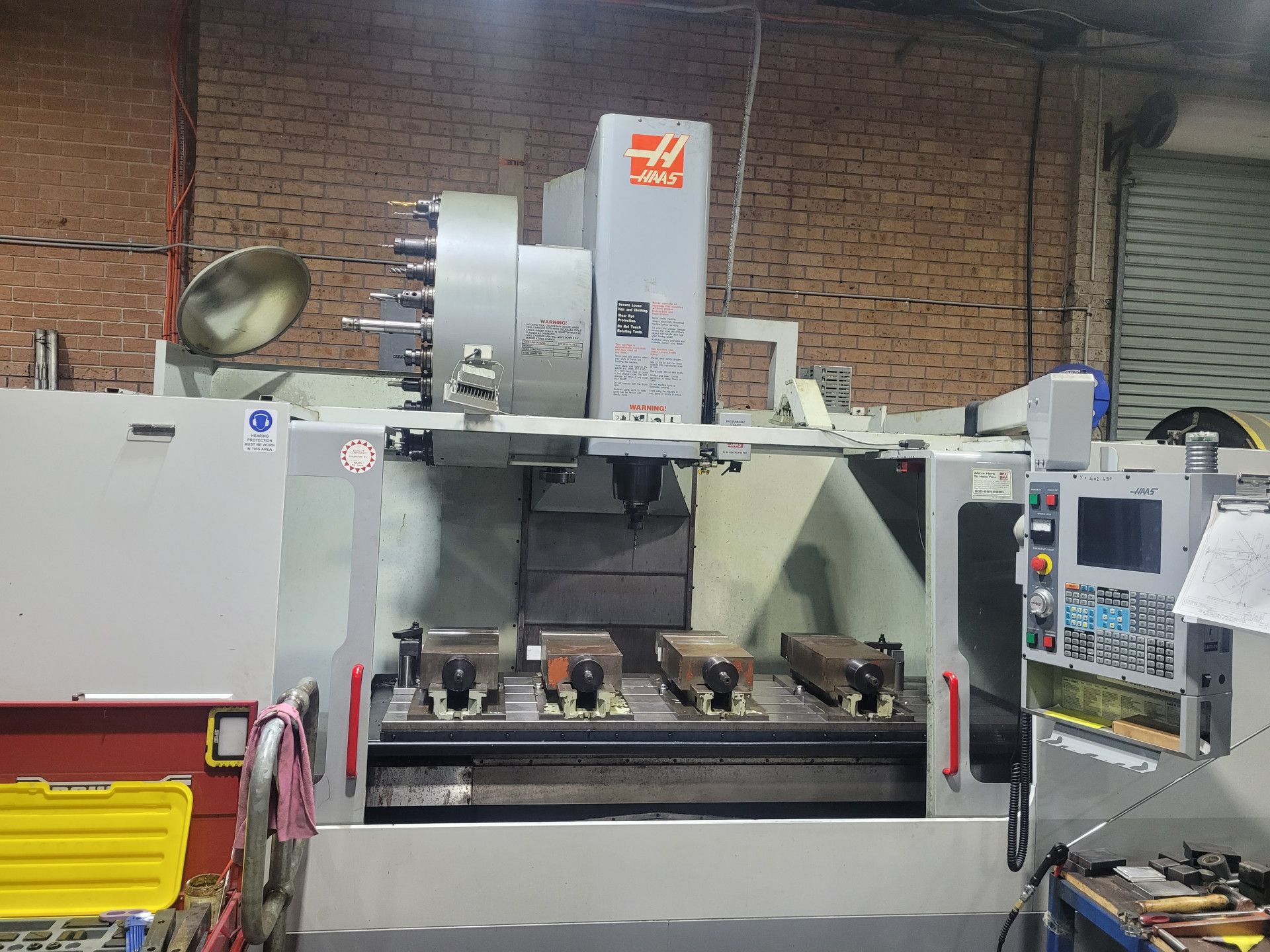 A Large Grey Haas Industrial Cnc Milling Machine Sits in A Workshop — Real Engineering in West Gosford, NSW