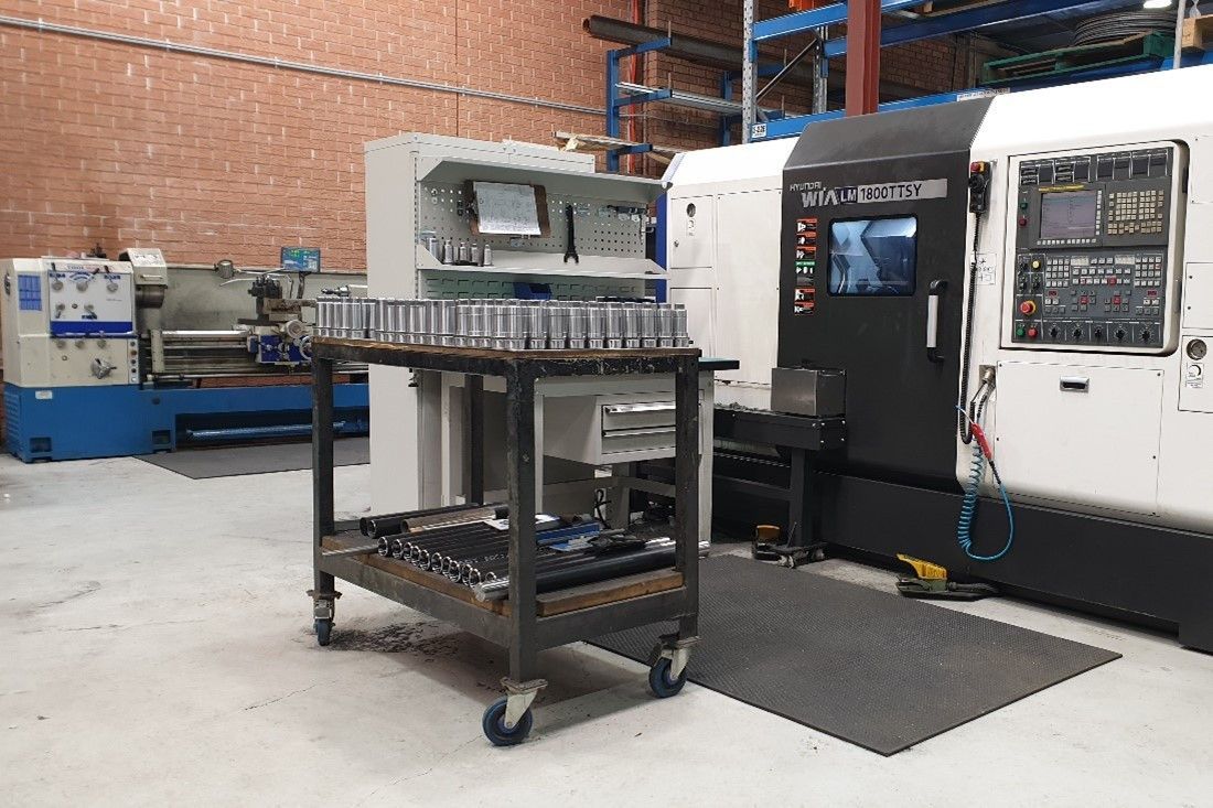 A Industrial Workshop Interior Featuring a Metal Utility Cart with Parts — Real Engineering in West Gosford, NSW