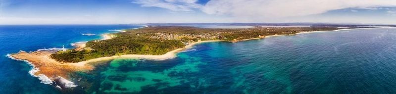 An Aerial View of a Small Island in the Middle of the Ocean — Real Engineering In Tuggerah, NSW