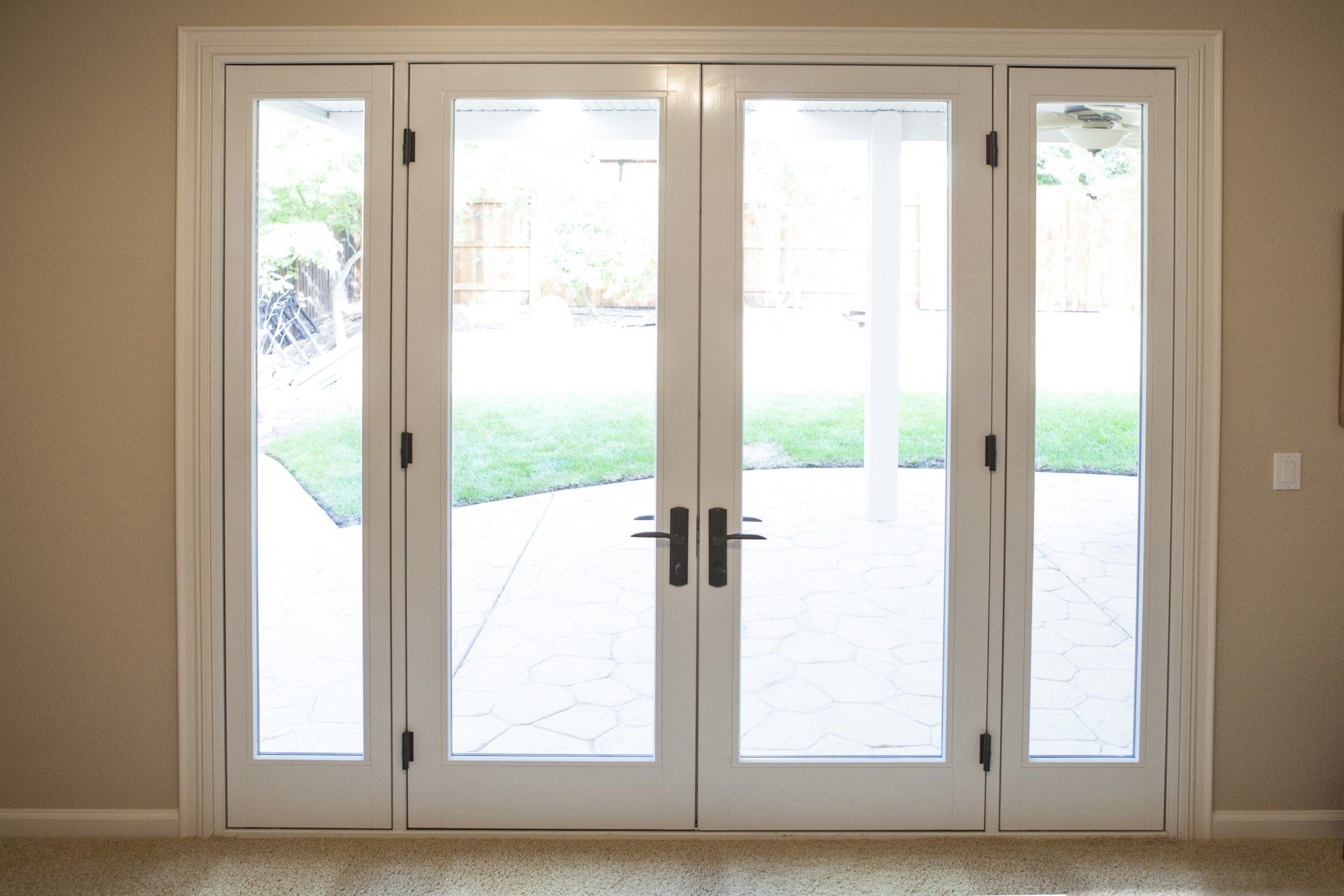 White French doors leading to a patio.