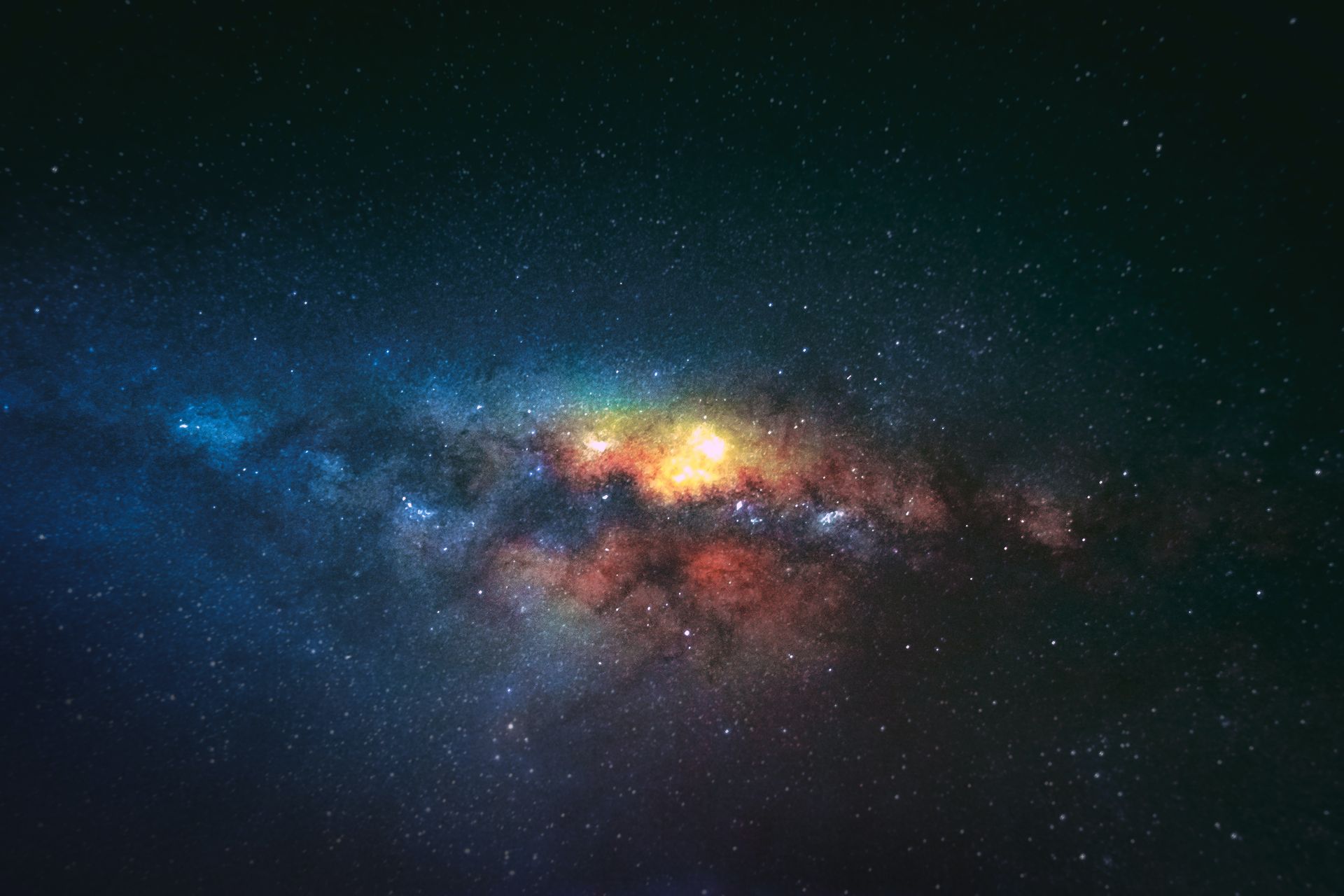 Image of the galaxy of different colors with stars, blue, yellow orange and red