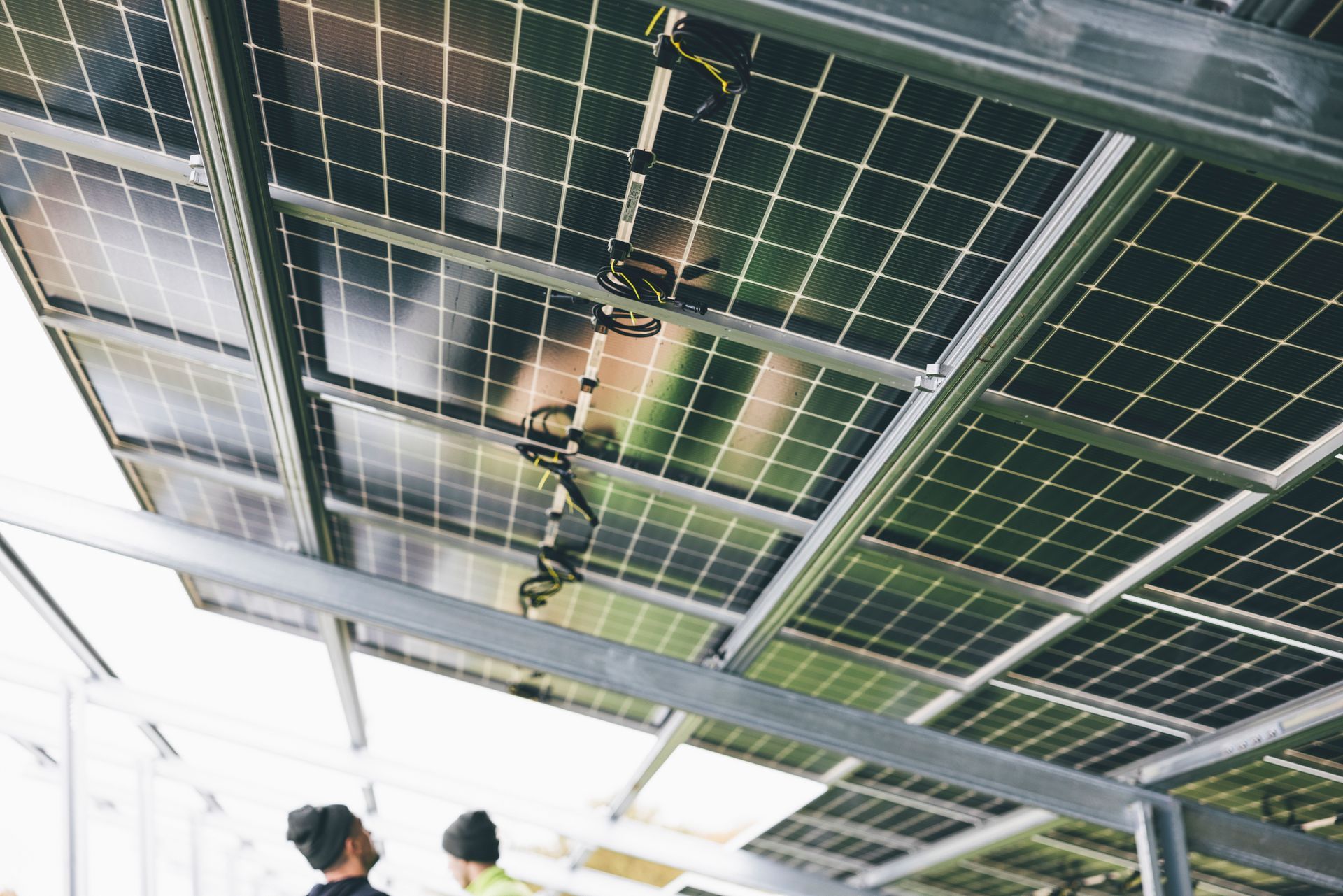 Solar panels mounted on a metal frame in an indoor industrial or lab setting