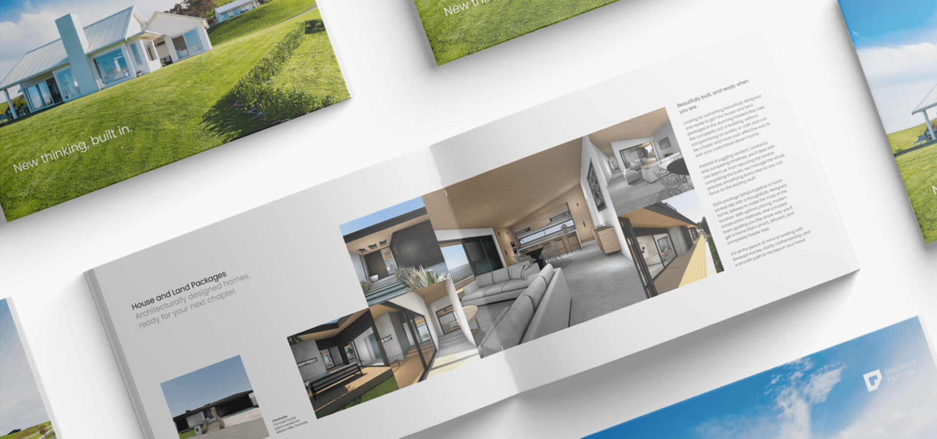 Brochure with house interior and exterior photos on white surface.