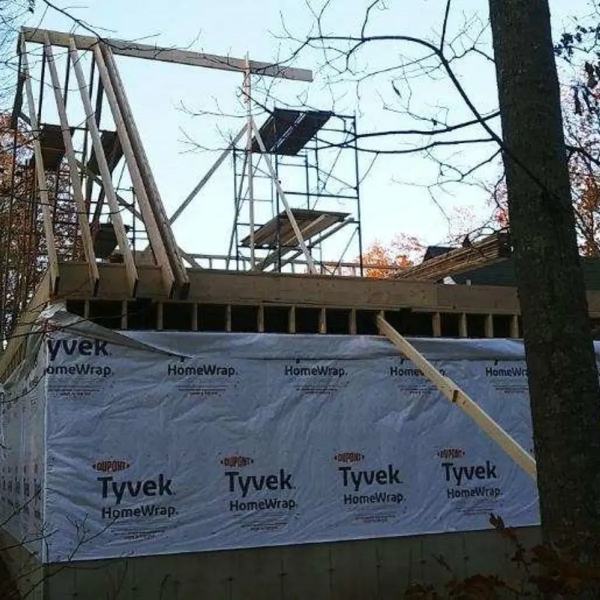 A roof is being built and covered with tyvek homewrap