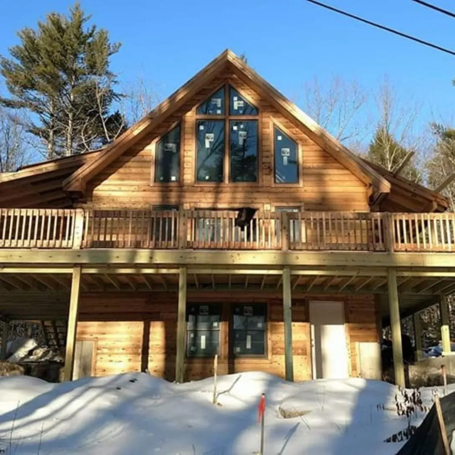 A large wooden house with a lot of windows
