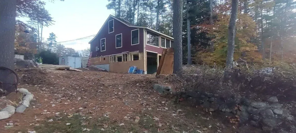 A house is being built in the middle of a forest.