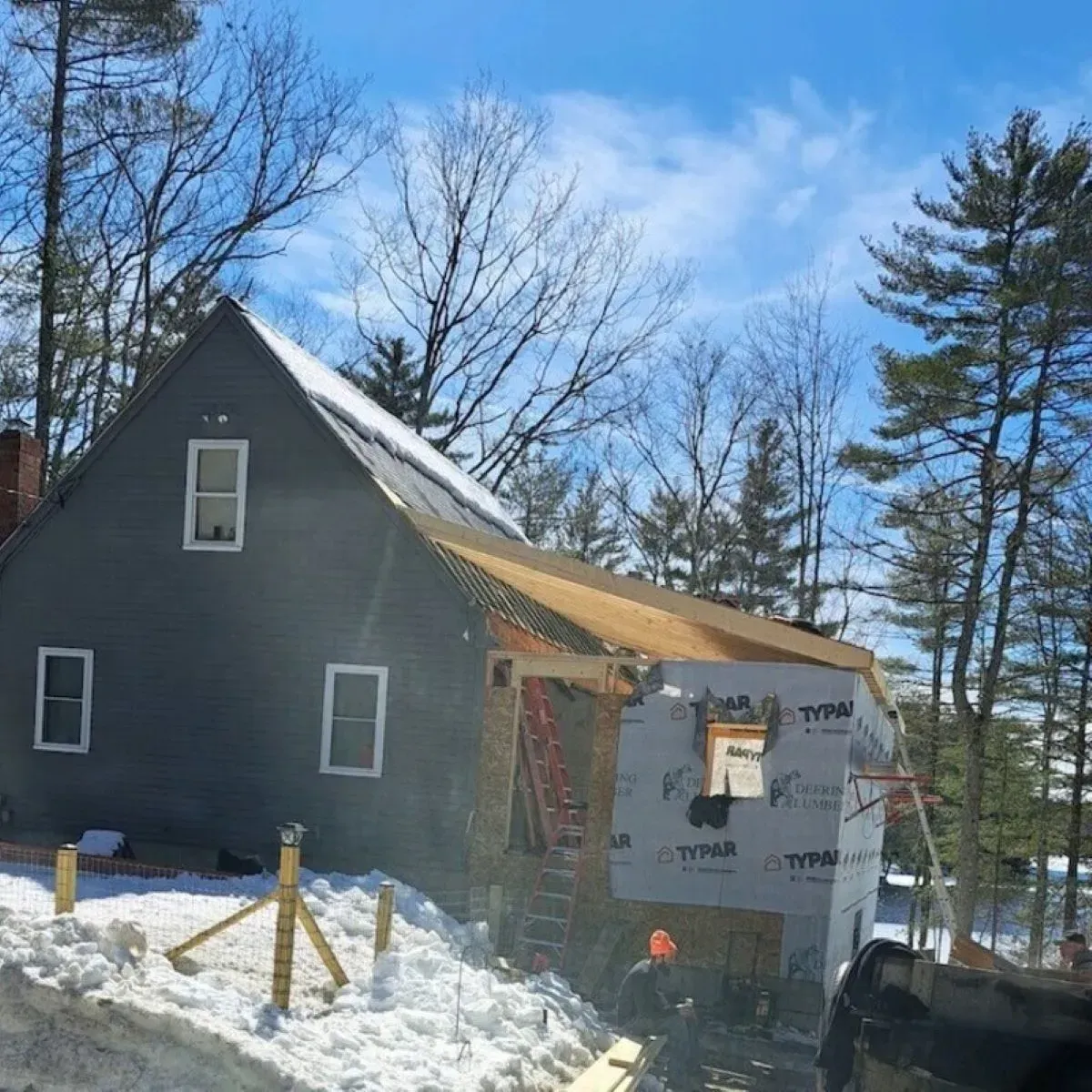 A house that is being built in the snow
