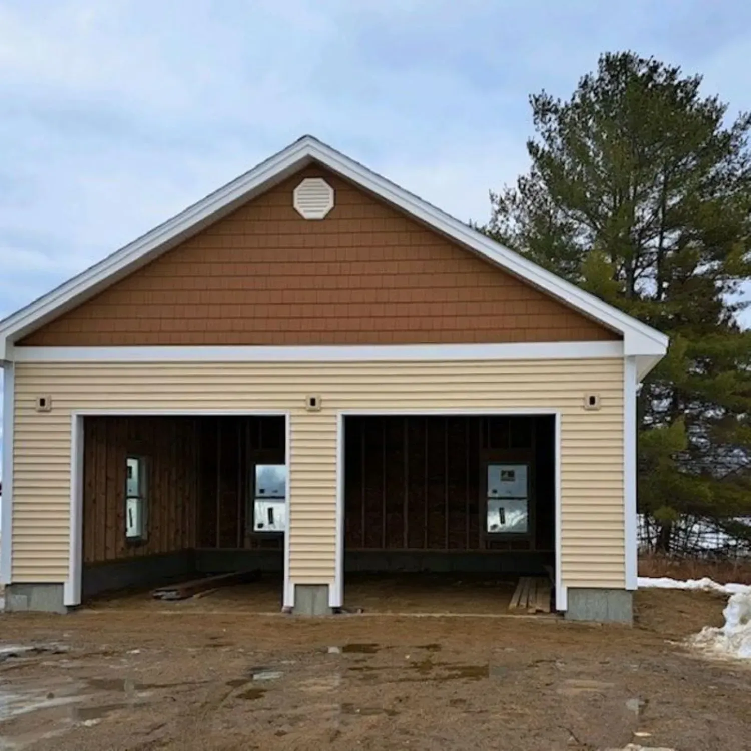 A garage with a brown roof and white trim