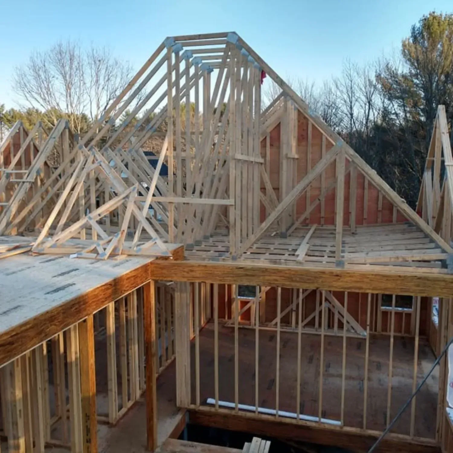 A house that is being built with a lot of wood