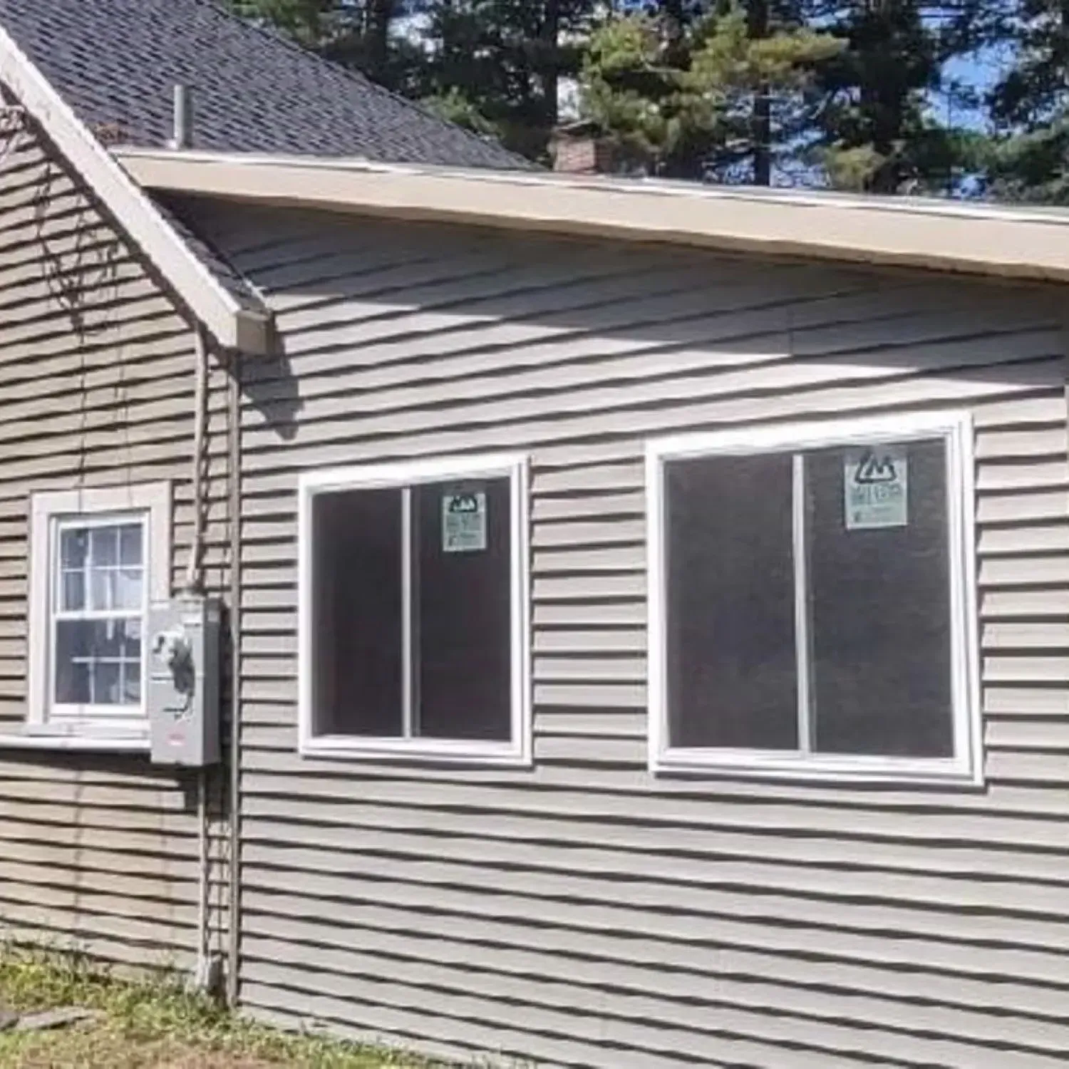 A house with a lot of windows on the side of it.