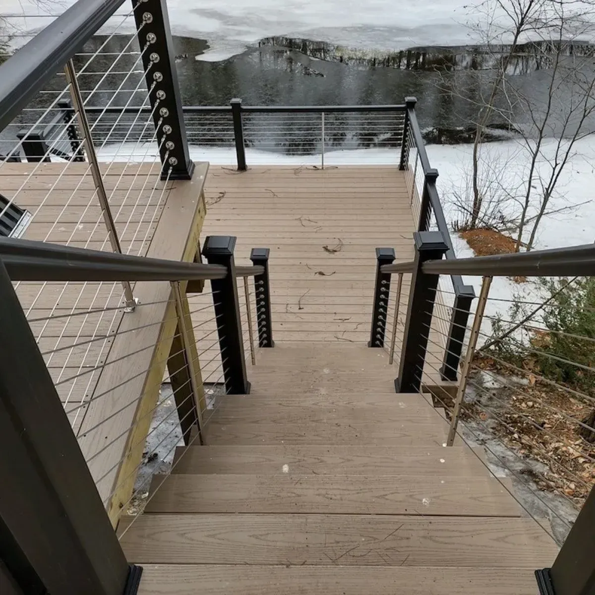 A wooden deck with stairs leading up to it