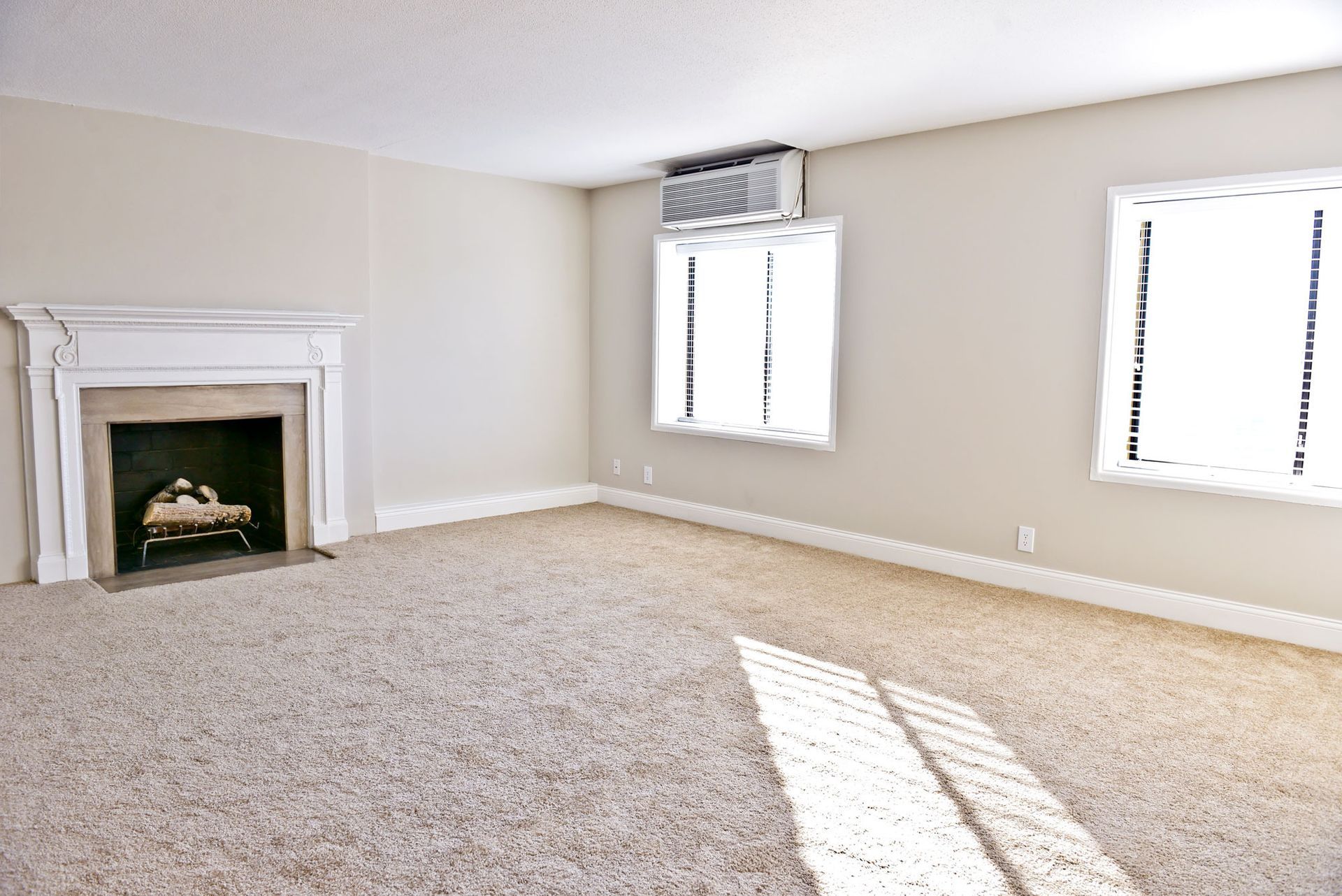 Carpeted living room at Circle City in Indianapolis, IN.