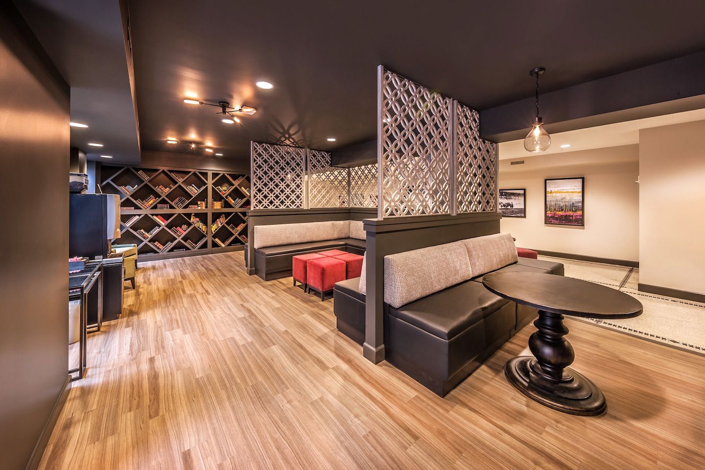 A room with a table and benches in it