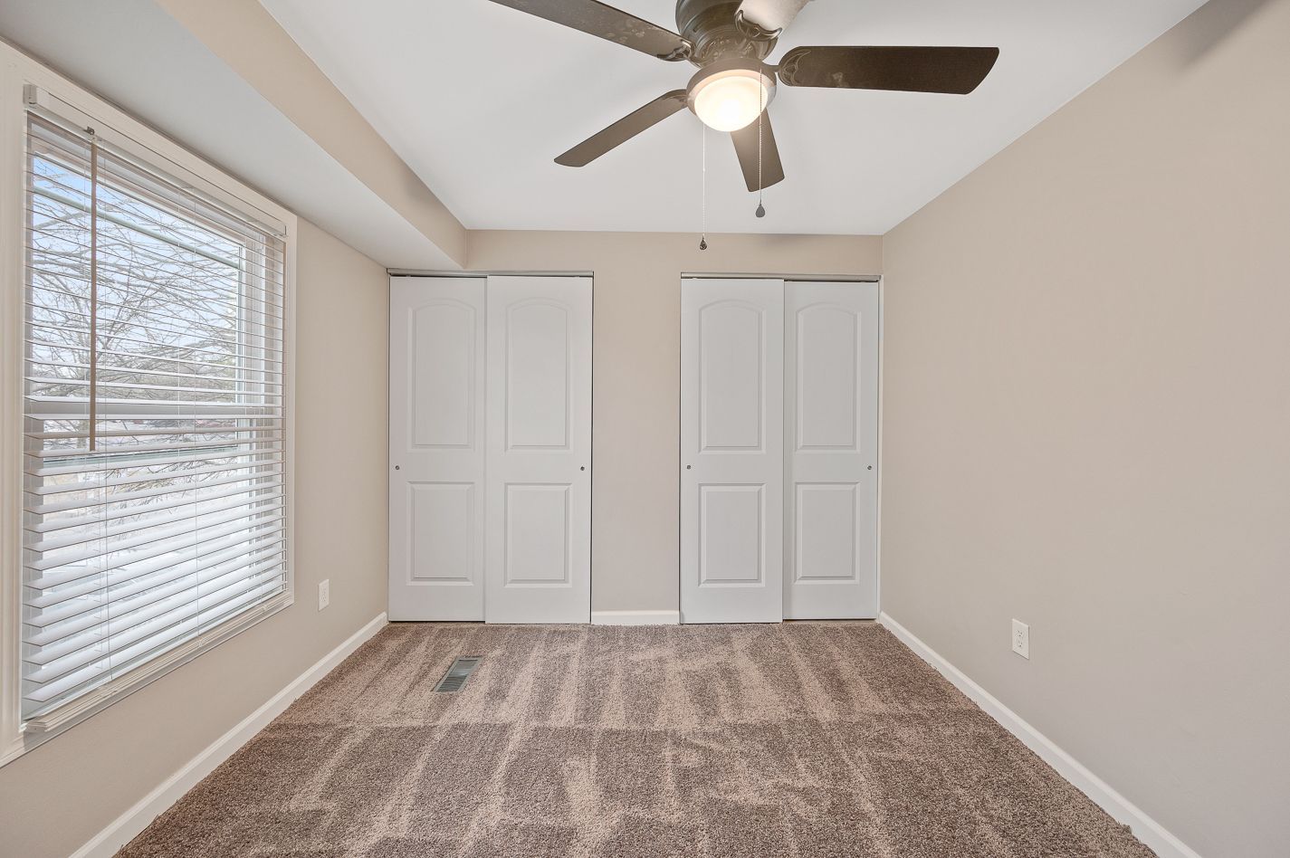 Image of a bedroom with natural light coming in