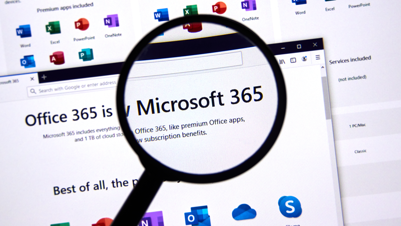 A magnifying glass is looking at a microsoft 365 website.