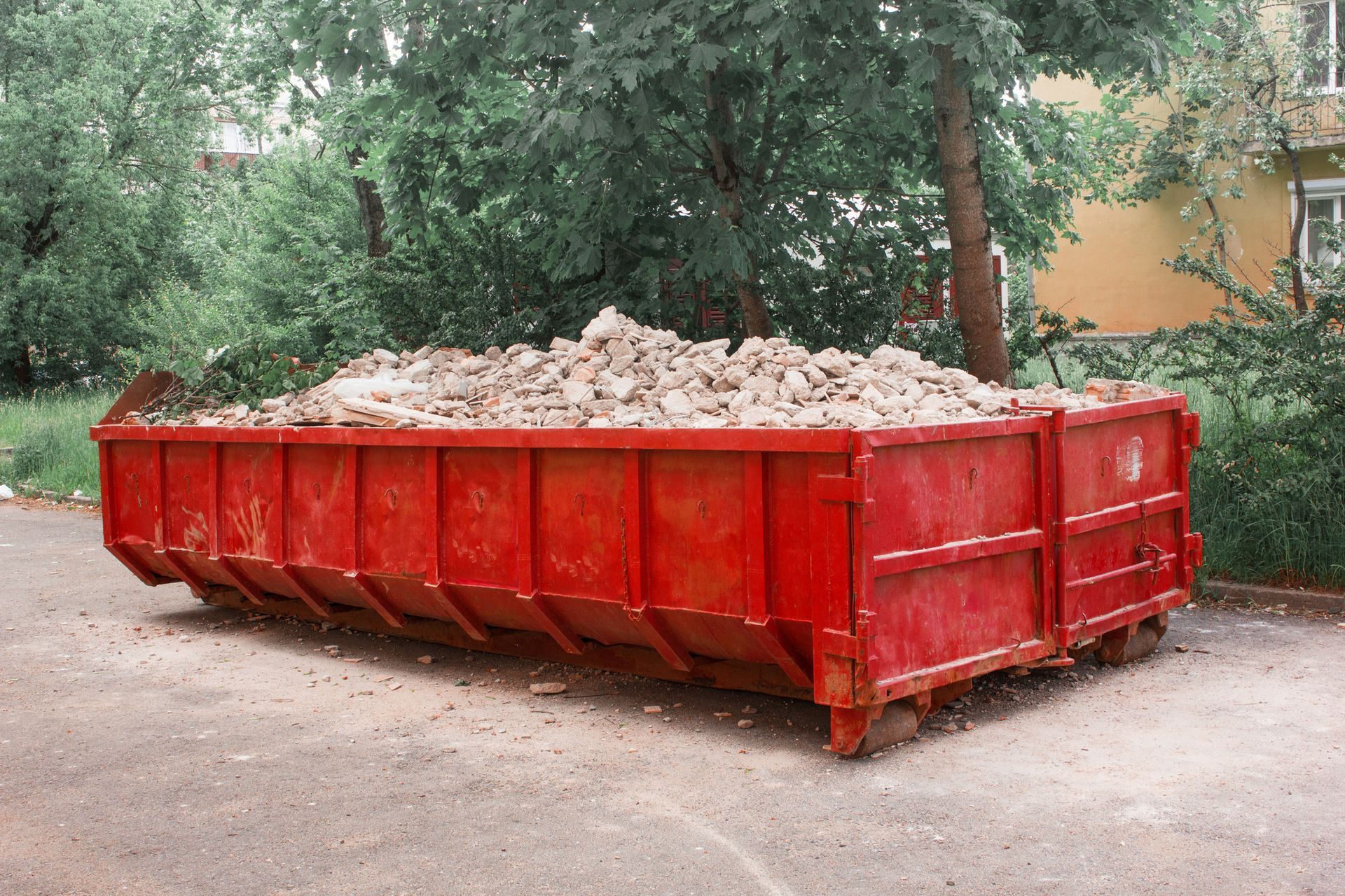 Red container with solid domestic and construction waste. Red container with solid domestic and construction waste.