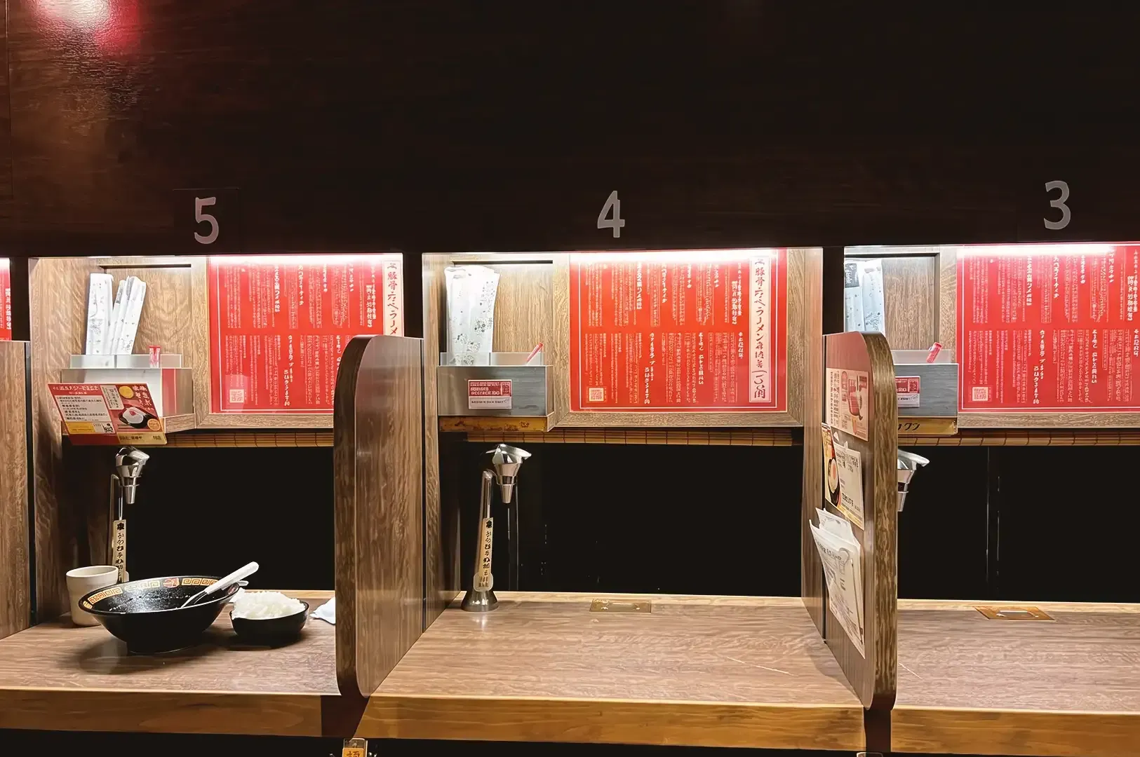 Individual ramen serving area with respective numbers made out of sturdy wood material