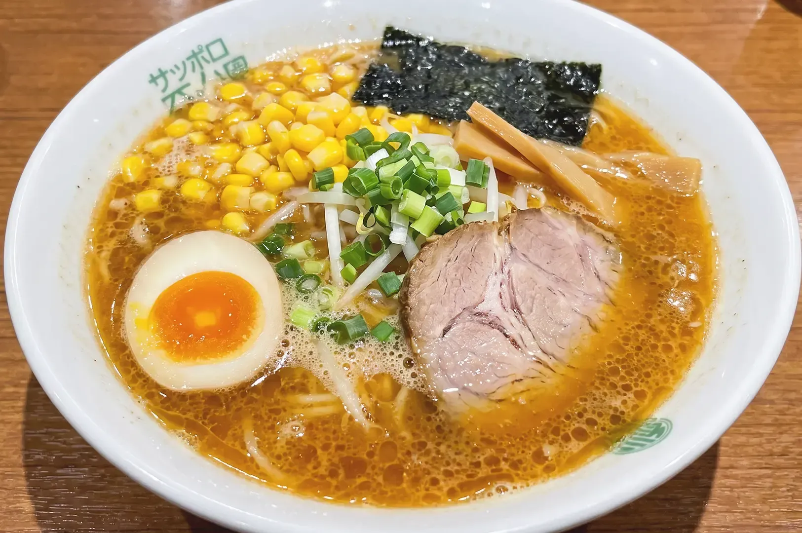 Ramen noodles with chashu, egg, spring onions, corn and seaweed