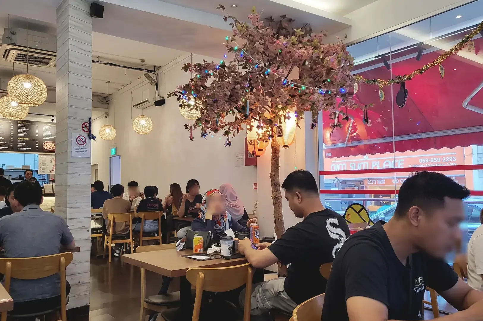 Ramen Stall interior occupied by people with slight warm ambient light