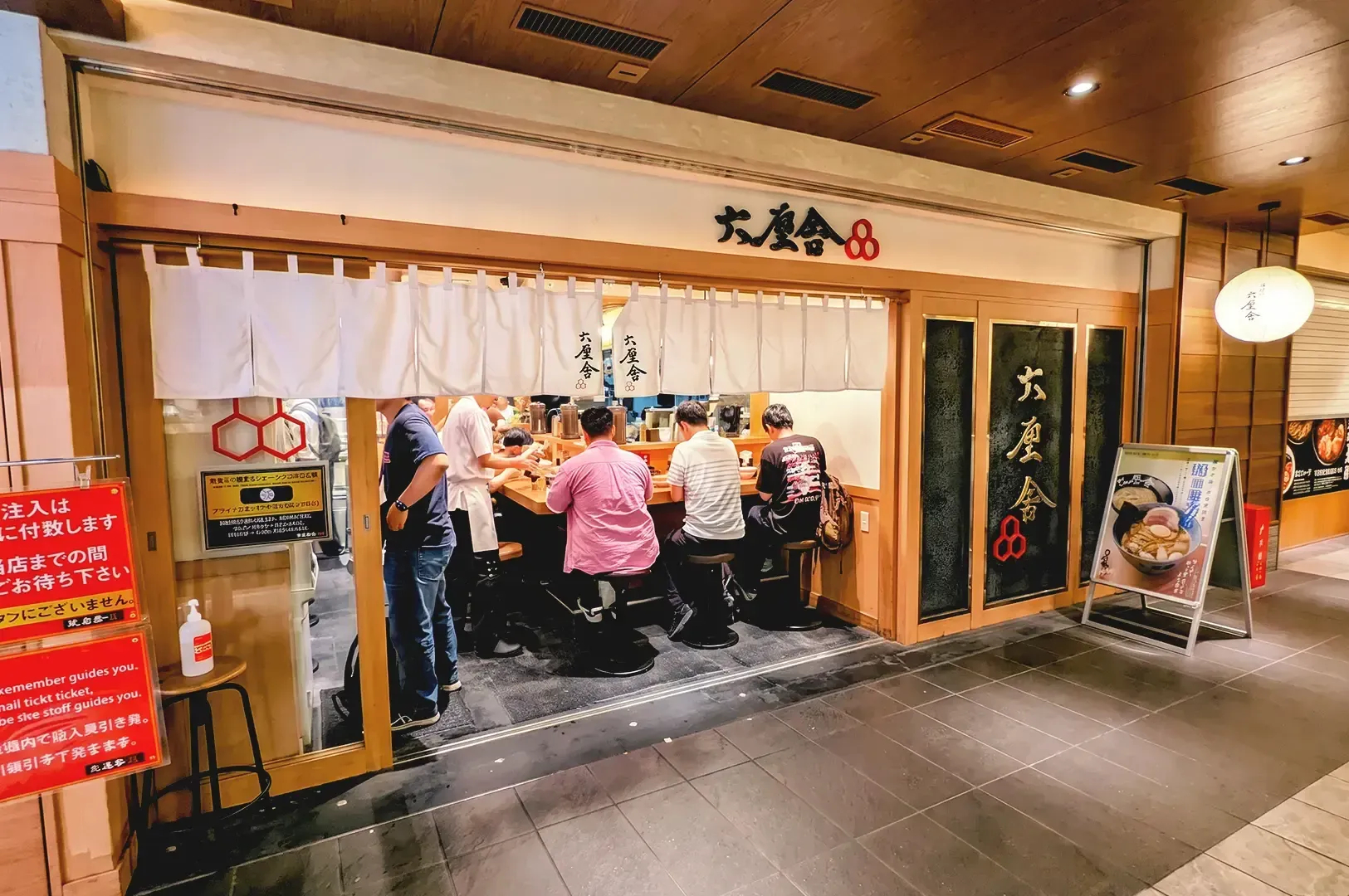 Traditional wooden ramen shop store of Rokurinsha with food signages