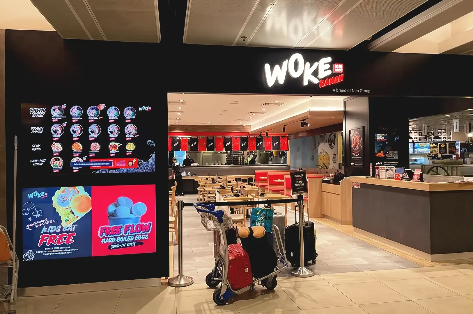 Modern black and wood themed store of Woke Ramen located in Changi Airport Terminal 1