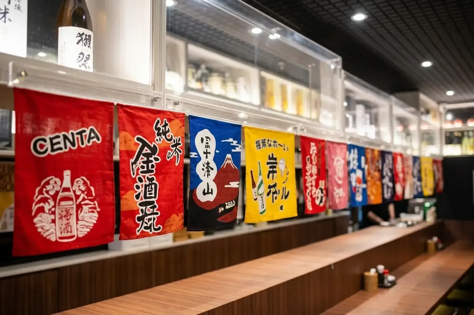 Japanese sake flags hanging above a wooden bar counter